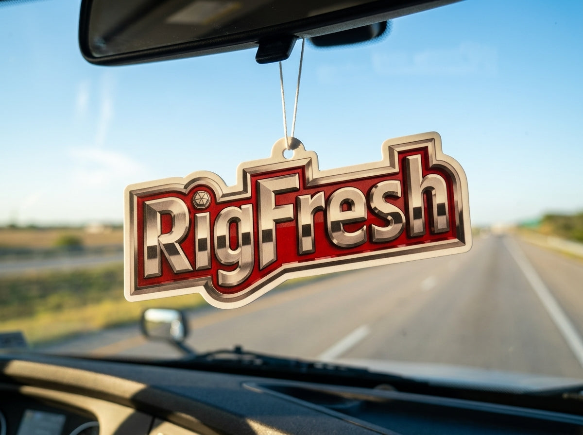 A RigFresh freshener hanging from a car rearview mirror