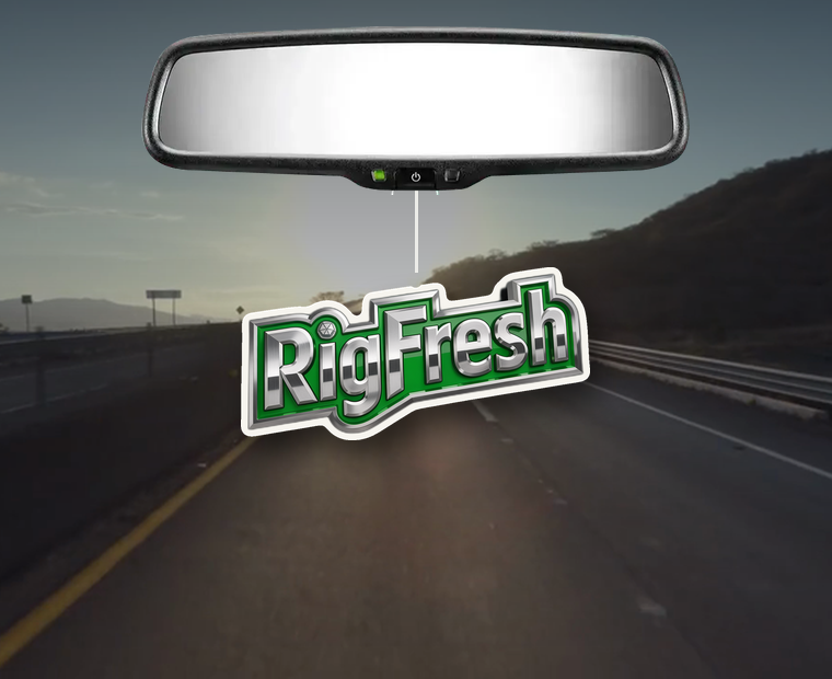 A RigFresh freshener hanging from a car rearview mirror